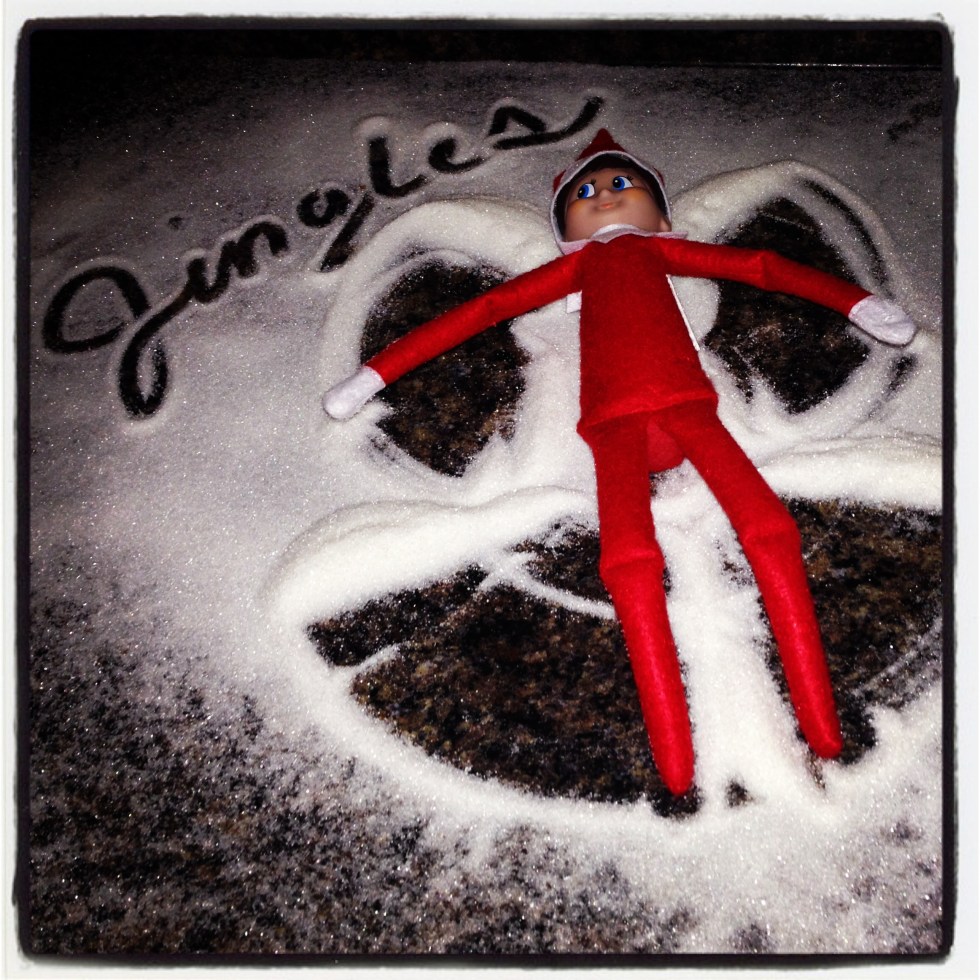Jingles the Elf making a sugar snow angel at my brother's house. Photo Cred: my brother