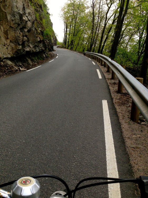 Biking back uphill from town on an old one speed mountain bike.