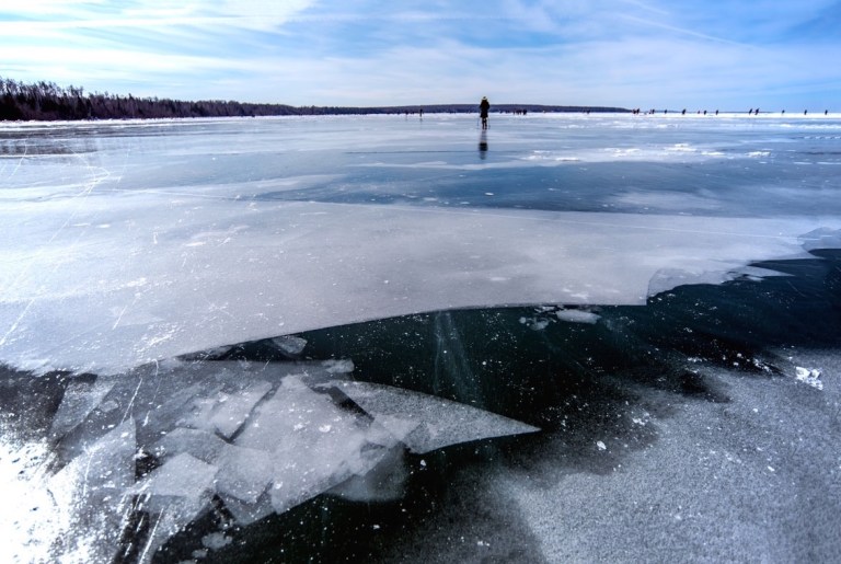Tiny me, walking across giant icy Lake Superior. Photo Credit: my dad